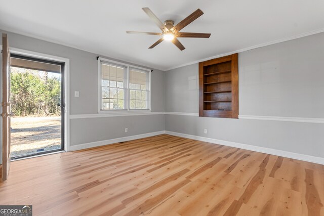 unfurnished room featuring crown molding, ceiling fan, and light hardwood / wood-style flooring