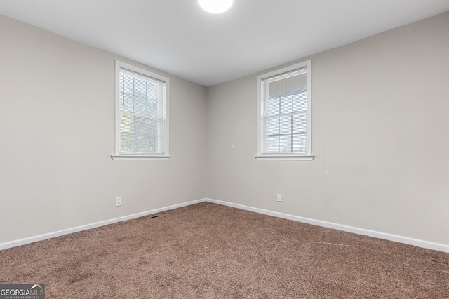 empty room featuring carpet floors