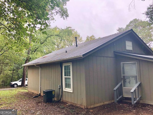 view of side of property featuring cooling unit