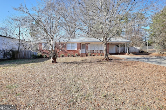 ranch-style home with a carport