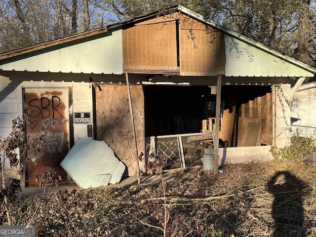 view of home's exterior featuring an outdoor structure