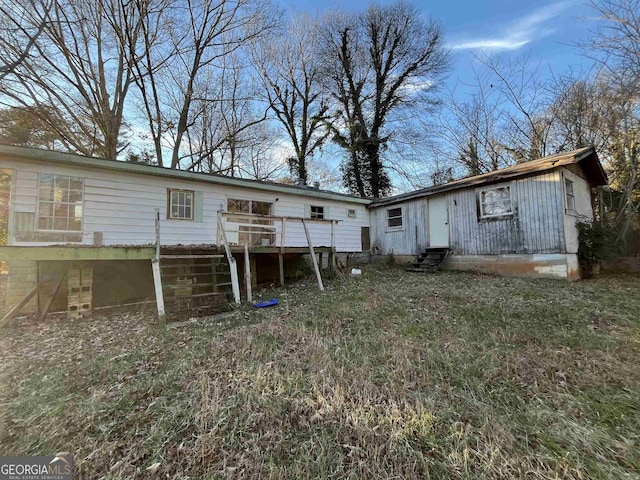 rear view of house featuring a deck