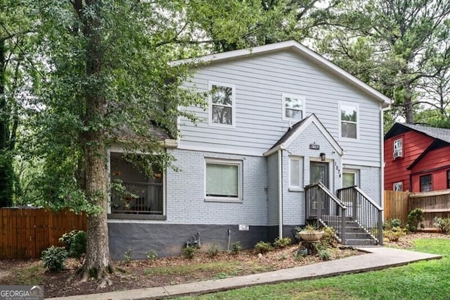 1574 Mayflower St, Atlanta, GA 30311 - traditional-style house featuring fence and brick siding