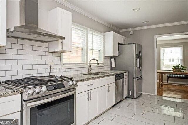 1574 Mayflower St, Atlanta, GA 30311 - kitchen with a sink, white cabinetry, wall chimney range hood, light stone countertops, and appliances with stainless steel finishes