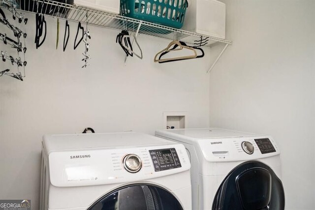 1574 Mayflower St, Atlanta, GA 30311 - clothes washing area with washing machine and dryer and laundry area