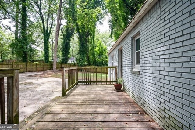 1574 Mayflower St, Atlanta, GA 30311 - wooden deck featuring a patio and a fenced backyard