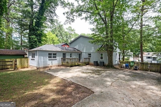 1574 Mayflower St, Atlanta, GA 30311 - rear view of property with central air condition unit, driveway, fence, a deck, and a patio