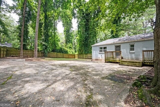 1574 Mayflower St, Atlanta, GA 30311 - view of yard with fence and a wooden deck