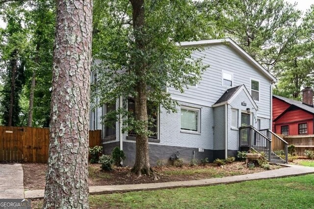 1574 Mayflower St, Atlanta, GA 30311 - view of front of house featuring brick siding and fence