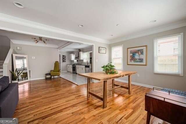 1574 Mayflower St, Atlanta, GA 30311 - dining space featuring baseboards, crown molding, and light wood-style flooring