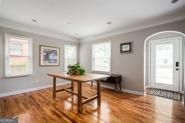 1574 Mayflower St, Atlanta, GA 30311 - office featuring baseboards, arched walkways, light wood-style floors, and crown molding