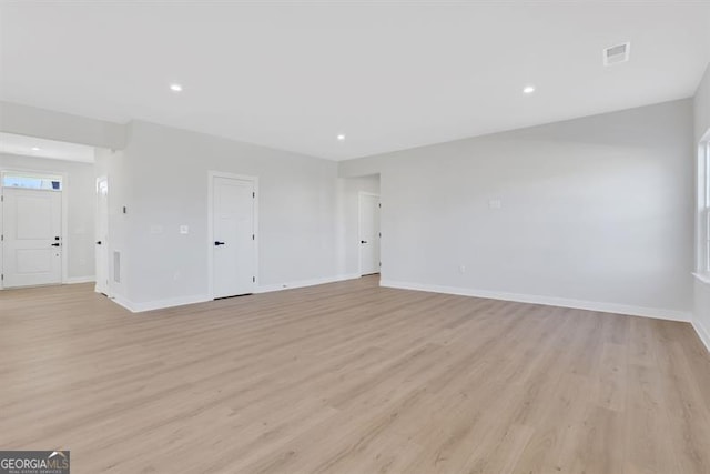 unfurnished room featuring light hardwood / wood-style floors