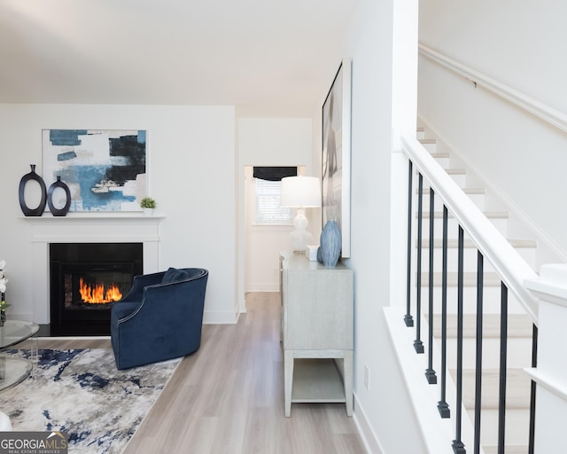 living room with light hardwood / wood-style flooring