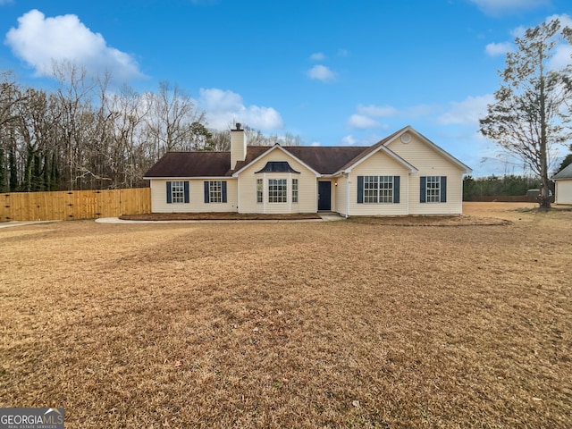 ranch-style home with a front yard