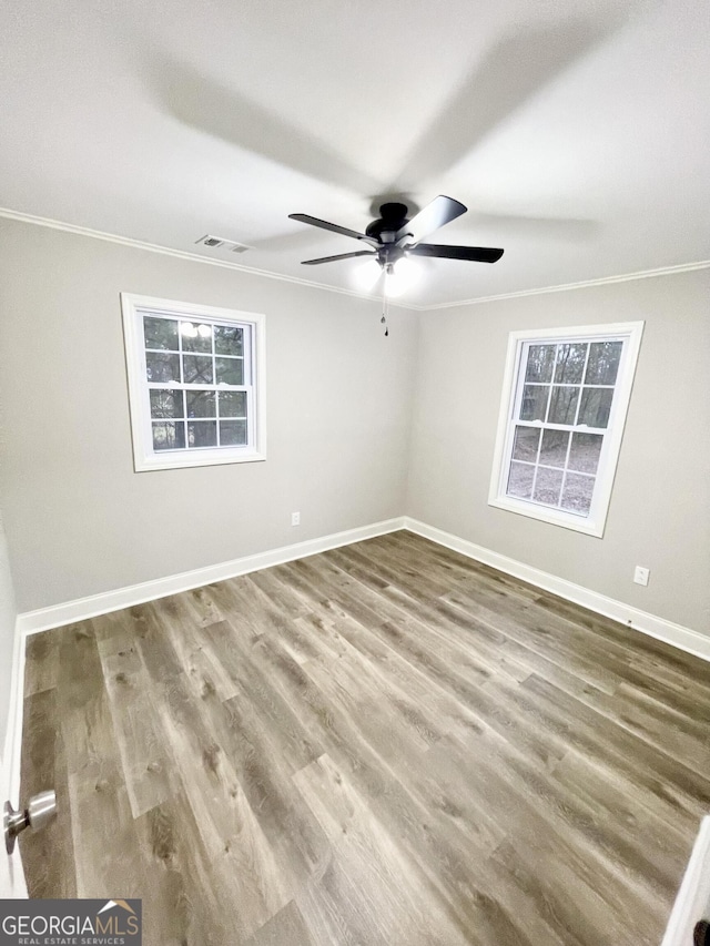 unfurnished room with crown molding, ceiling fan, and hardwood / wood-style floors