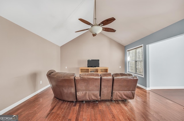 living room with hardwood / wood-style flooring, ceiling fan, and lofted ceiling