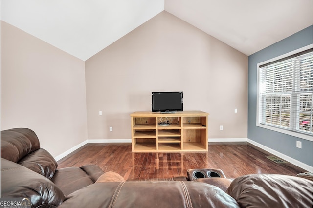 living room with lofted ceiling and hardwood / wood-style floors