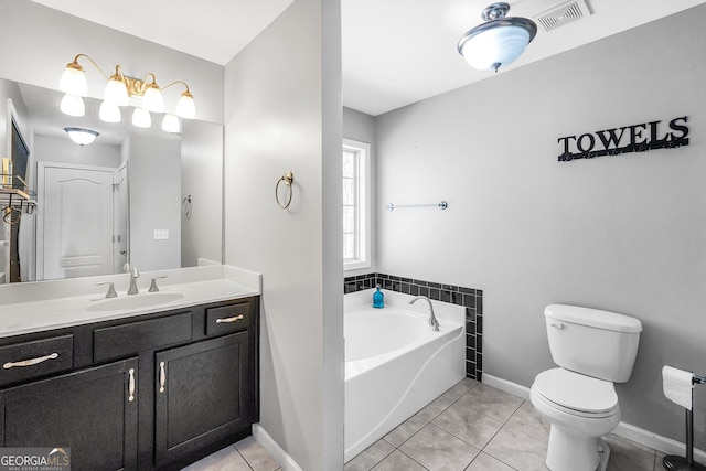 bathroom with vanity, a bath, tile patterned floors, and toilet