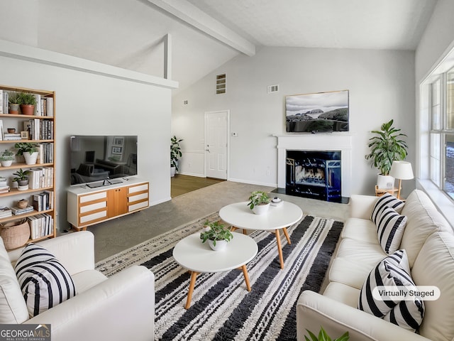 living room featuring vaulted ceiling with beams and a fireplace