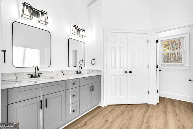 bathroom with vanity and hardwood / wood-style floors