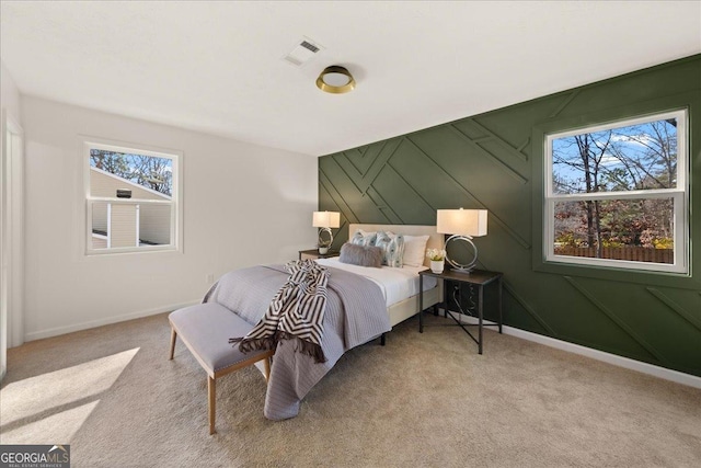 bedroom with light colored carpet