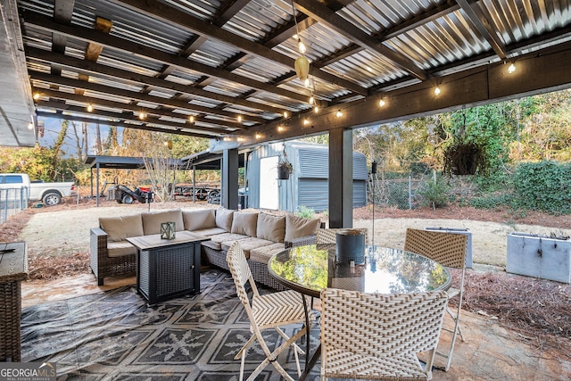 view of patio with an outdoor hangout area and a shed