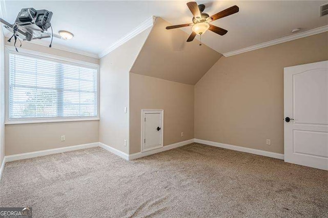 additional living space featuring ceiling fan, lofted ceiling, and light carpet