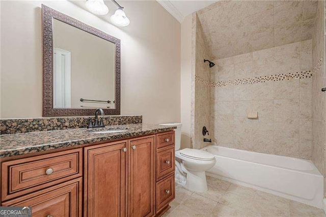 full bathroom featuring tiled shower / bath combo, vanity, toilet, crown molding, and tile patterned floors