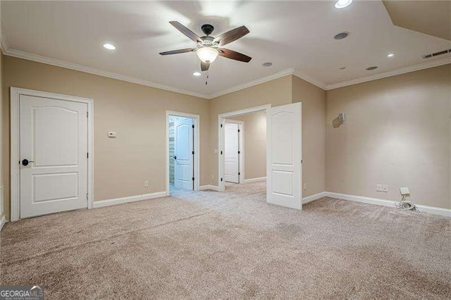 unfurnished bedroom featuring ornamental molding, light colored carpet, and ceiling fan