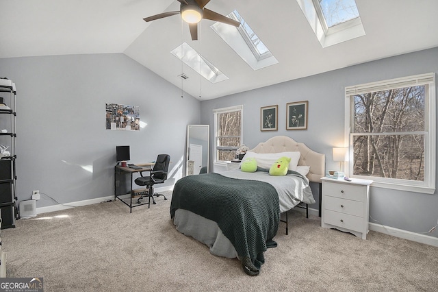 bedroom featuring vaulted ceiling, light colored carpet, and ceiling fan