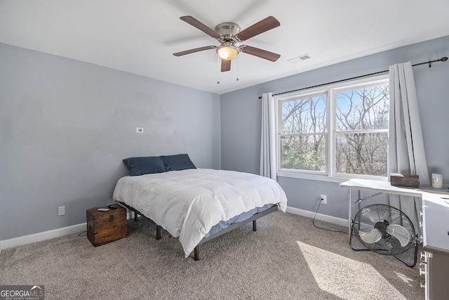 bedroom featuring light carpet and ceiling fan