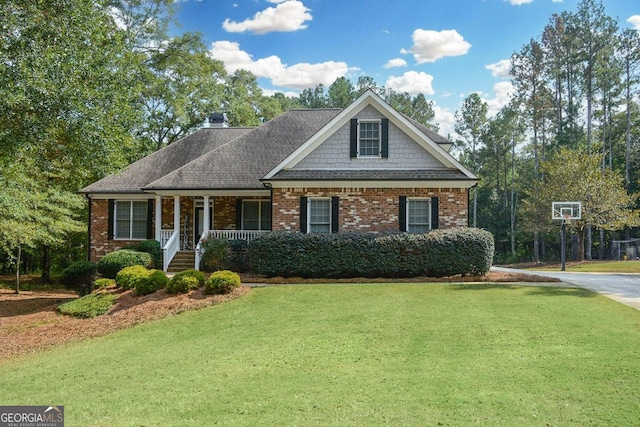 view of front of home featuring a porch and a front lawn