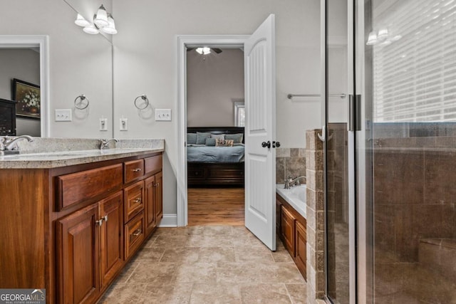 bathroom with vanity, plenty of natural light, and independent shower and bath