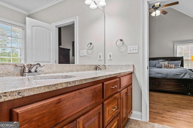 bathroom with vanity, crown molding, a wealth of natural light, and ceiling fan