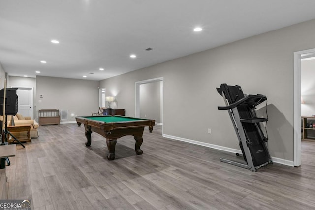 rec room with pool table and light hardwood / wood-style flooring