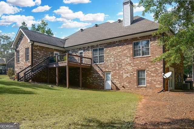 back of property with a yard, central AC, and a deck