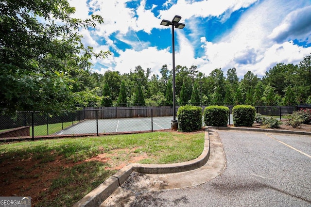 exterior space featuring tennis court