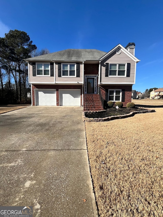 split foyer home featuring a garage