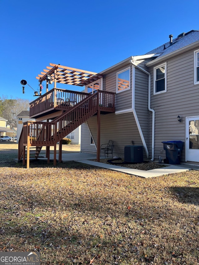 back of house with cooling unit, a wooden deck, a pergola, and a patio area