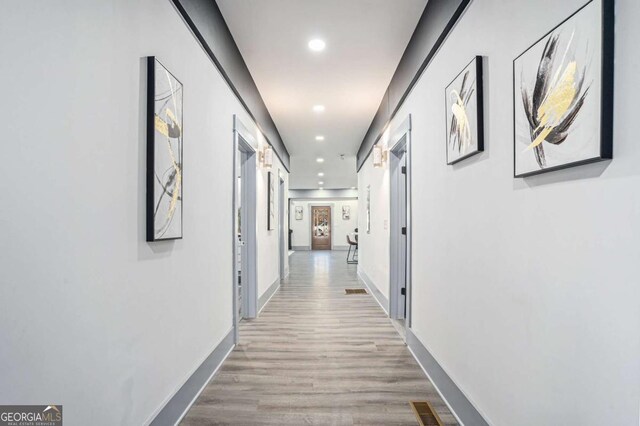 corridor featuring light wood-type flooring