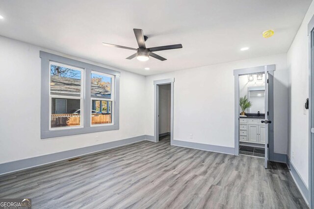 unfurnished room with ceiling fan and light hardwood / wood-style flooring