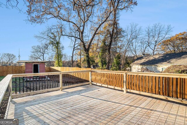 wooden deck featuring a shed