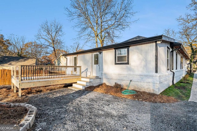 view of front of property with a wooden deck