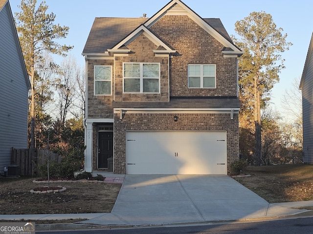 view of front of home with a garage and central air condition unit