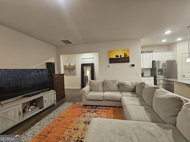 living room featuring dark wood-type flooring