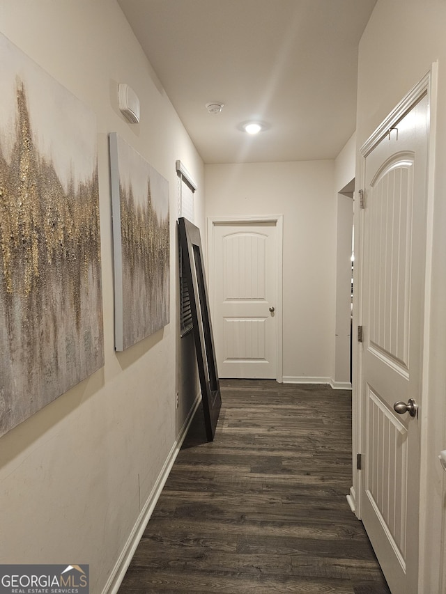 corridor featuring dark hardwood / wood-style flooring