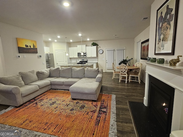 living room with dark wood-type flooring