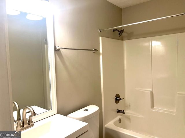 full bathroom featuring shower / washtub combination, vanity, and toilet