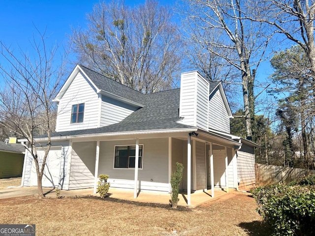 exterior space featuring a garage and covered porch