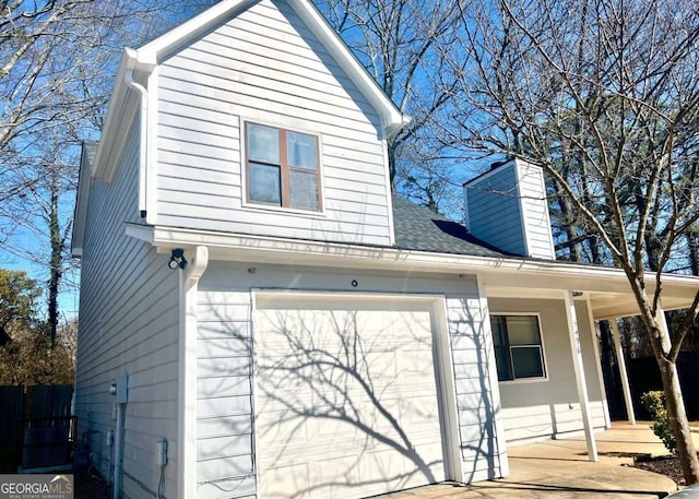 view of side of home with a garage